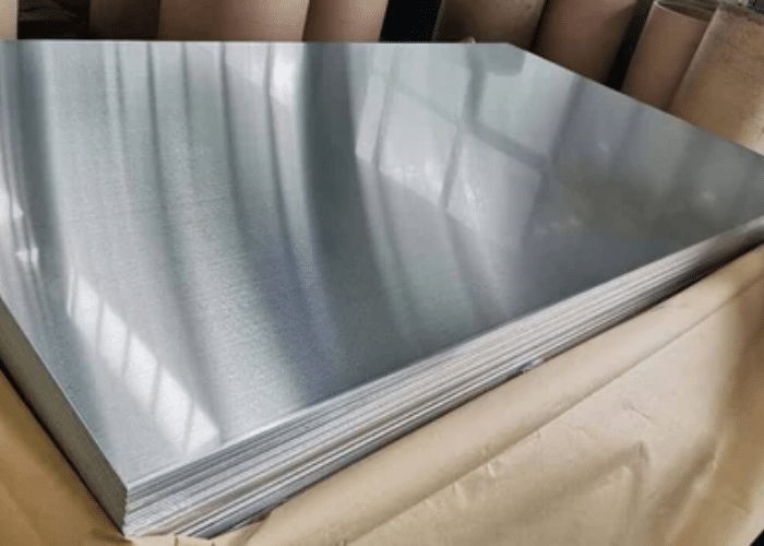 Stack of 4x8 sheet metal on industrial wooden pallets ready for shipping